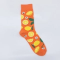Detailed view of orange cotton mid-calf socks with vibrant lemon and flower jacquard patterns - One Size / Orange