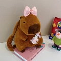 Brown Capybara plush backpack featuring a pink bow and a white rabbit doll accessory - 35cm / Pink Bowknot