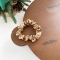 Elegant gold satin scrunchie hair tie on wooden background with natural decor - Small / Khaki