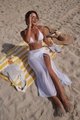Top-down shot of white halter bikini with gold ring detail and mesh beach skirt on towel - S / Three-Piece Set / White