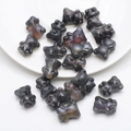 Macro detail of iridescent dark grey bear-shaped crystal beads for DIY jewelry making - Frosted Gun Black Purple