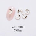 Detailed view of crescent moon nail charms with gold metallic frames on pink manicure - Moon Gold White Style (9489)
