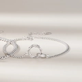 Silbernes Mobius Dornen-Armband mit verflochtenen Ringen an einer eleganten Panzerkette - 925er Silber / Dorn Mobius Armband Damen