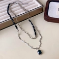 Double-layered necklace with black beads, silver cross, and faceted gemstone pendant - Double-Layer Cross Black Gem Style
