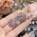 Close-up of star-shaped earrings with pink sapphire and multi-color zircon stones - 0233 3D Star Multi-color Gem Studs