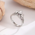 Detailed macro view of crown ring featuring pear-shaped zircons and pink gemstones - Silver Triple Pear Crown Ring (WG0-1118)