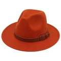 Close-up of orange wool felt fedora featuring a brown leather band and silver metal buckle - Caramel color