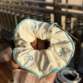 Cream fabric scrunchie with blue edge piping and butterfly embroidery detail - Blue Trim Yellow Stripe Scrunchie with Blue Bow