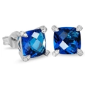 Detailed macro view of square deep blue zircon studs with silver prong settings - White Gold Blue Zirconia