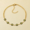 Bracelet de cheville en acier doré avec breloque marguerite noire et jaune à huit pétales - Or-Noir