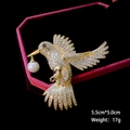 Detailed view of hummingbird brooch with white pearls and crystals on jewelry box - B449/Hummingbird Shape