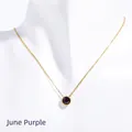 Minimalist gold necklace with a round purple June birthstone pendant on a model neck - June Purple (Alexandrite Color)