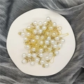 Golden safety pins with pearl and rhinestone detail on white ceramic plate for candy boxes - Rhinestone Pearl Pin Accessories