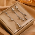 Silver teardrop necklace and earrings set displayed on a beige jewelry box - Silver Tone Stainless Steel Waterdrop Earring & Necklace Set