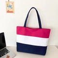 Detail of three-color canvas tote bag featuring pink white and dark blue horizontal stripes - Rose Red