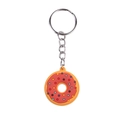 Portachiavi a forma di ciambella colorata con glassa rossa e granella su sfondo bianco - Stile ttq-3