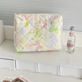 Close-up of quilted floral makeup bag with macaron patterns and diamond stitching detail - Dreamy Butterfly Handbag / Yellow