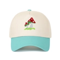 Detailed close-up of mushroom embroidery on a two-tone canvas trucker hat with contrast brim - Adjustable / Lake Blue