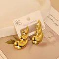 Polierte goldene Edelstahl-Ohrringe in wellenförmigem, geschichtetem Tropfendesign - Gold Dynamische Welle (23)