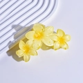 Close-up of yellow floral matte acrylic hair claw clip on a textured display - 5# Lemon Yellow Gradient Triple Plumeria