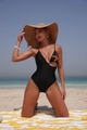 Detail of black one-piece swimsuit with sequin starfish and side waist cut-out - S / Black