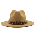 Detail of vintage camel wool fedora hat featuring ethnic beaded band and copper buckle - Camel