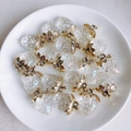 Detail of DIY glittery strawberry resin pendants with gold leaf caps on a white plate - 9# Transparent Iridescent