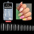 Set mit 100 klaren, dünnen Nagelspitzen in zehn Größen von 0 bis 9 auf schwarzem Grund - Vollständige Abdeckung Quadratischer Stil / 100 Stück / Transparent