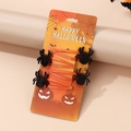 Set of 4 orange Halloween spider hair clips with black glitter on a themed card - Black Glitter Spiders (Set of 4)