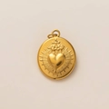 Golden titanium steel oval pendant featuring a sacred heart relief and cross design - Oval Sacred Heart Pendant