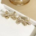 Elegant gold bow earrings with sparkling micro-pave crystals on a gray jewelry box - 6#E4016 Gold