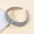 Elegant silver knotted headband featuring sparkling rhinestones and delicate pearls detail - Silver