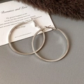 Minimalist large silver hoop earrings with a polished finish on textured background - Style 65 / Diameter 45mm / Silver