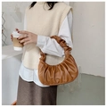 Detail of the brown ruched dumpling bag texture with elegant folds and soft PU leather - Brown