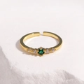 Close-up of adjustable gold-plated ring featuring an emerald green zircon center stone - Gold Green Zircon