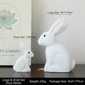 Set of two white Nordic rabbit sculptures in matte finish for modern home decor - With Eyes / Moonlight White