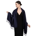 Detail of a dark blue luxury jacquard shawl with soft fringe tassels on a model - Royal Blue (T003-41)
