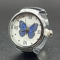 Silver finger watch with white dial featuring blue butterfly pattern and Roman numerals - Blue