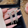 Elegant silver bow tassel earrings with sparkling rhinestones in a luxury style - Bowknot Diamond Tassel (E0034)
