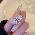 Macro shot of sparkling square halo stud earrings with brilliant-cut stones and silver finish - Silver (Silver Pin) / Silver