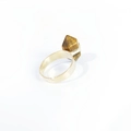 Golden ring featuring a natural hexagonal tiger eye crystal stone on a minimalist band - Tiger Eye