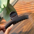Detail of the 11.5cm dark brown glossy claw clip showing the durable acrylic material - 11.5CM / Chocolate