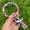 Porte-clés bracelet en cuir avec motif vache rose floral et pendentif pompon assorti - Léopard Rose