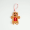 Gingerbread man felt ornament with red embroidered letter B and festive hanging ribbon - Letter B