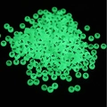 Close-up of 7x4mm luminous green round beads with black letter V for DIY crafts - Letter V / Luminous Green
