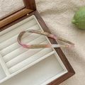 U-shaped acetate hair pin in pink and green gradient placed in a velvet jewelry box - Dreamy Pastel Pink