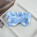 Light blue polka dot spa headband with a plush bow design for skincare and makeup - Blue Polka Dot Bow Hairband (109#)