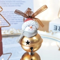 Christmas snowman bell ornament with gold metal base and red hat on a mirror tray - Snowman Bell