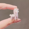 Mini pink alpaca resin figurine with knitted texture shown on a fingertip - 381# Pink Sheep