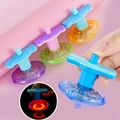 Colorful LED light-up music spinning top toy in multiple vibrant plastic colors - Glowing UFO Mini Gyro